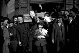 A_group_of_men_and_a_boy_carrying_groceries_during_the_Seattle_general_strike_February_7_1919_MOHAI_5445